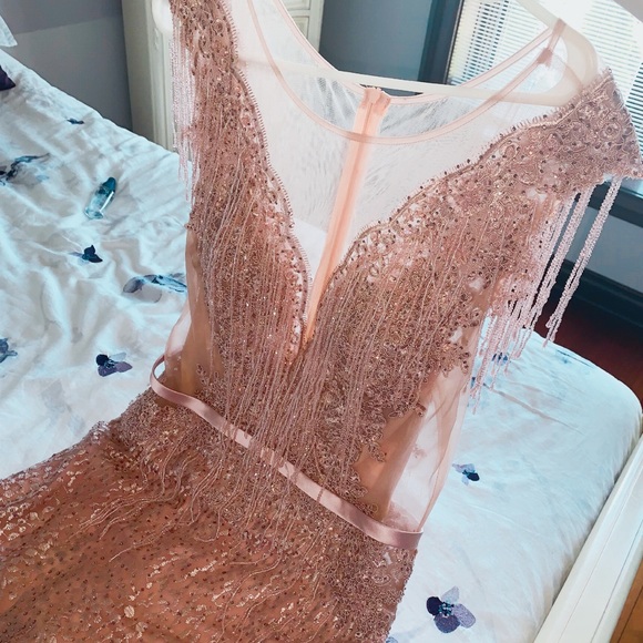 Blush pink dress with beaded details.